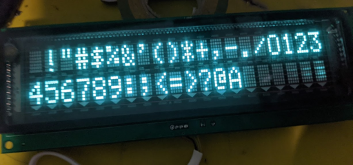 A VFD display showing part of the ASCII table