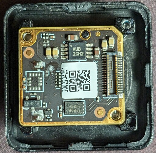 Bottom board of the camera with a QR code.